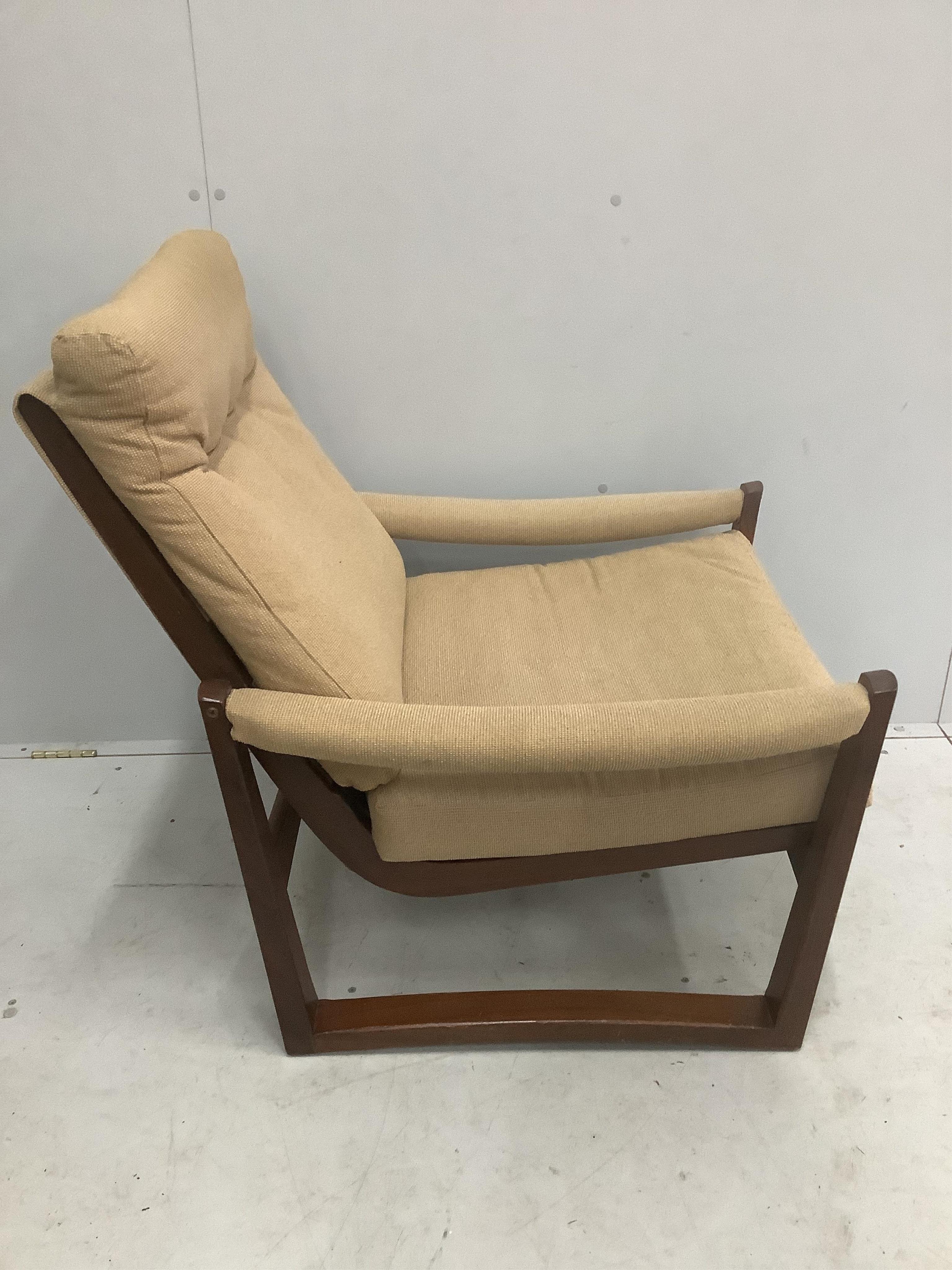 A mid century armchair, width 72cm, depth 80cm, height 88cm. Condition - fair